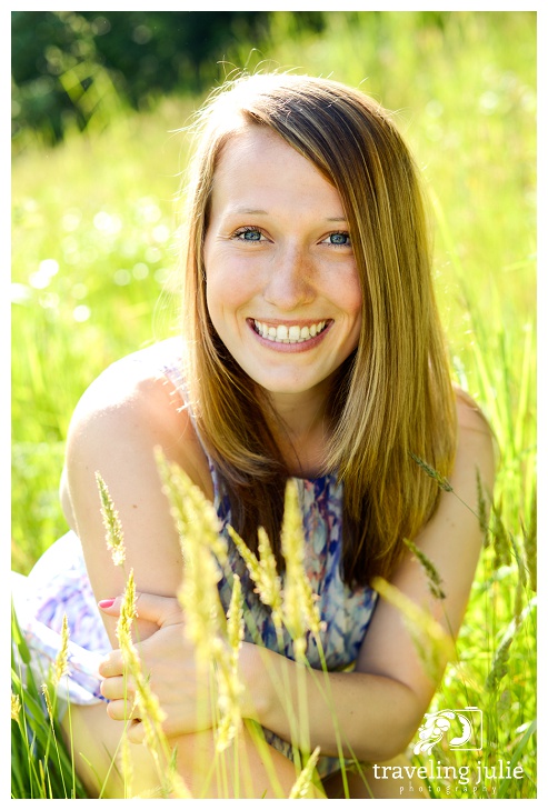 Smiling senior portrait in tall grass