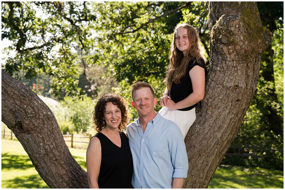 family portrait with a large tree